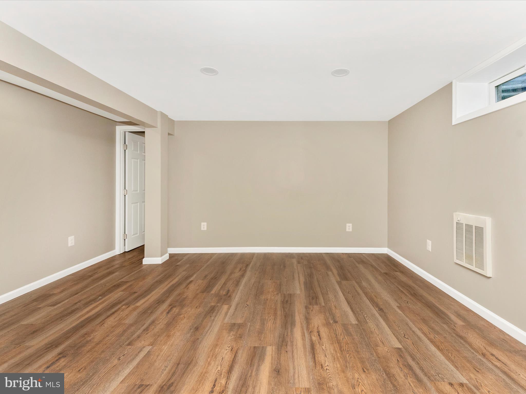 2833 Roderick Road Frederick, MD 21704 - Photo 30 of 41 a view of an empty room with wooden floor