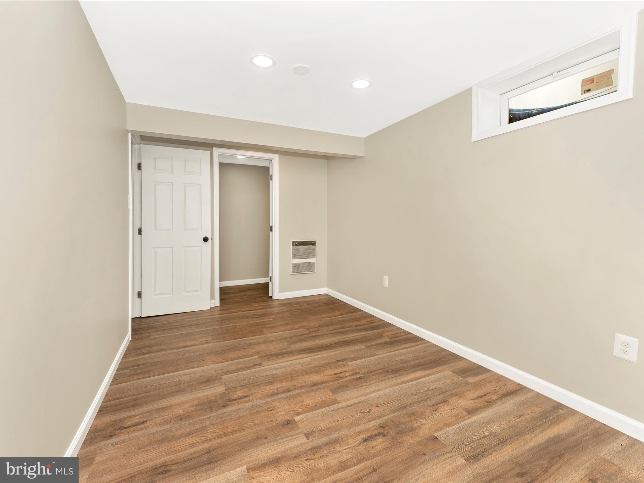 2833 Roderick Road Frederick, MD 21704 - Photo 32 of 41 a view of an empty room with wooden floor