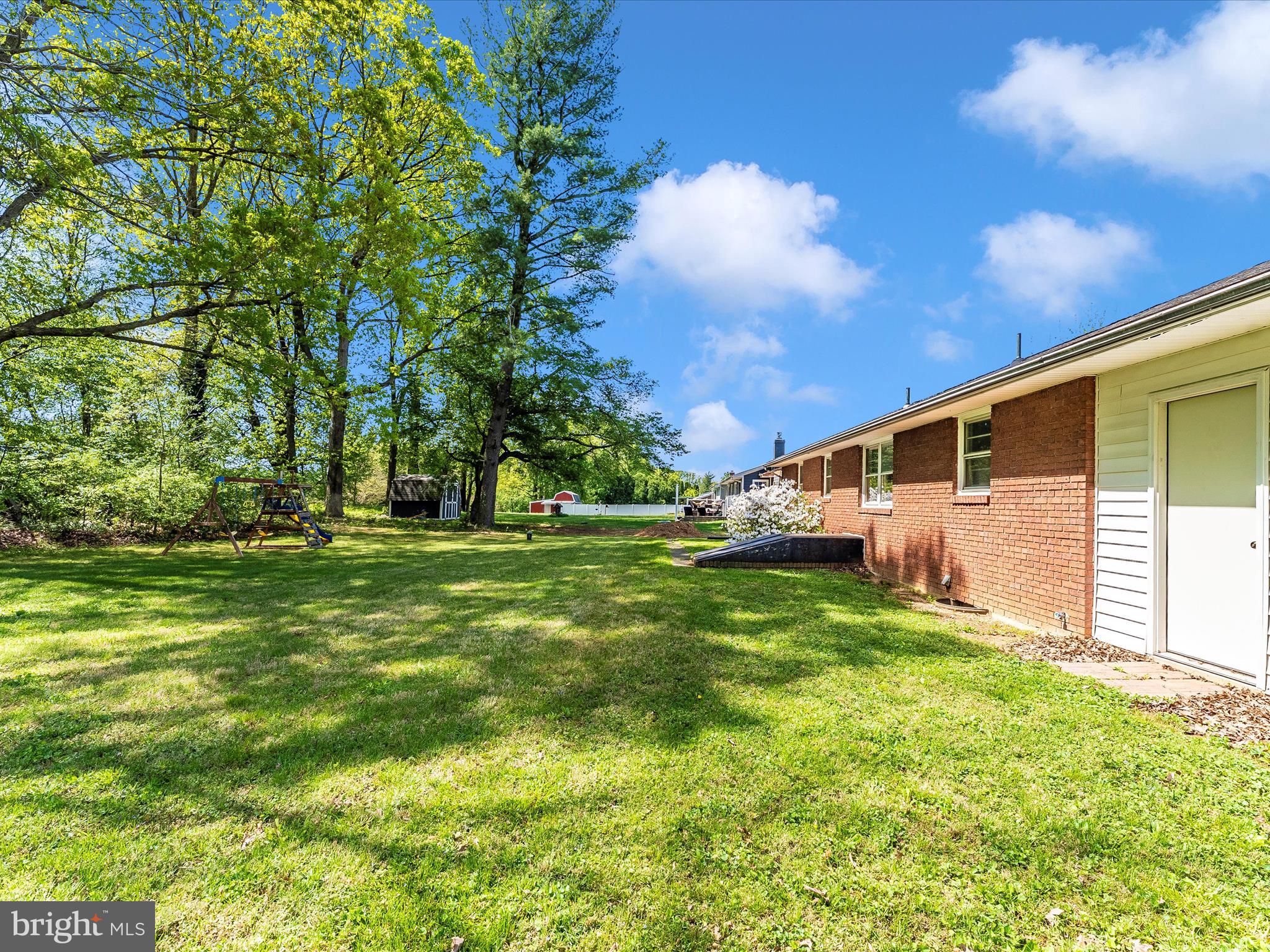 2833 Roderick Road Frederick, MD 21704 - Photo 36 of 41 a backyard of a house with plants and large tree