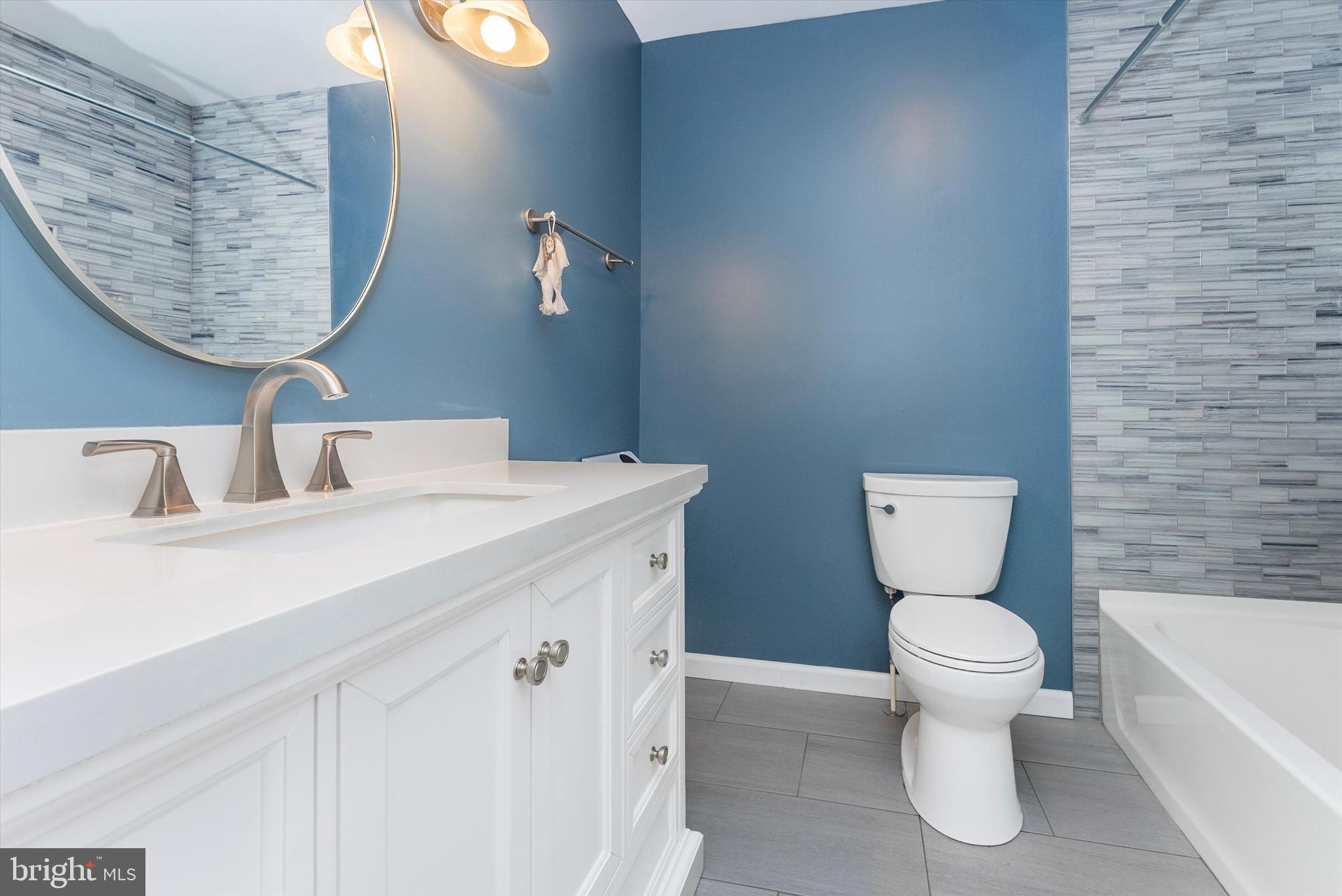 2833 Roderick Road Frederick, MD 21704 - Photo 4 of 41 a bathroom with a toilet sink and mirror