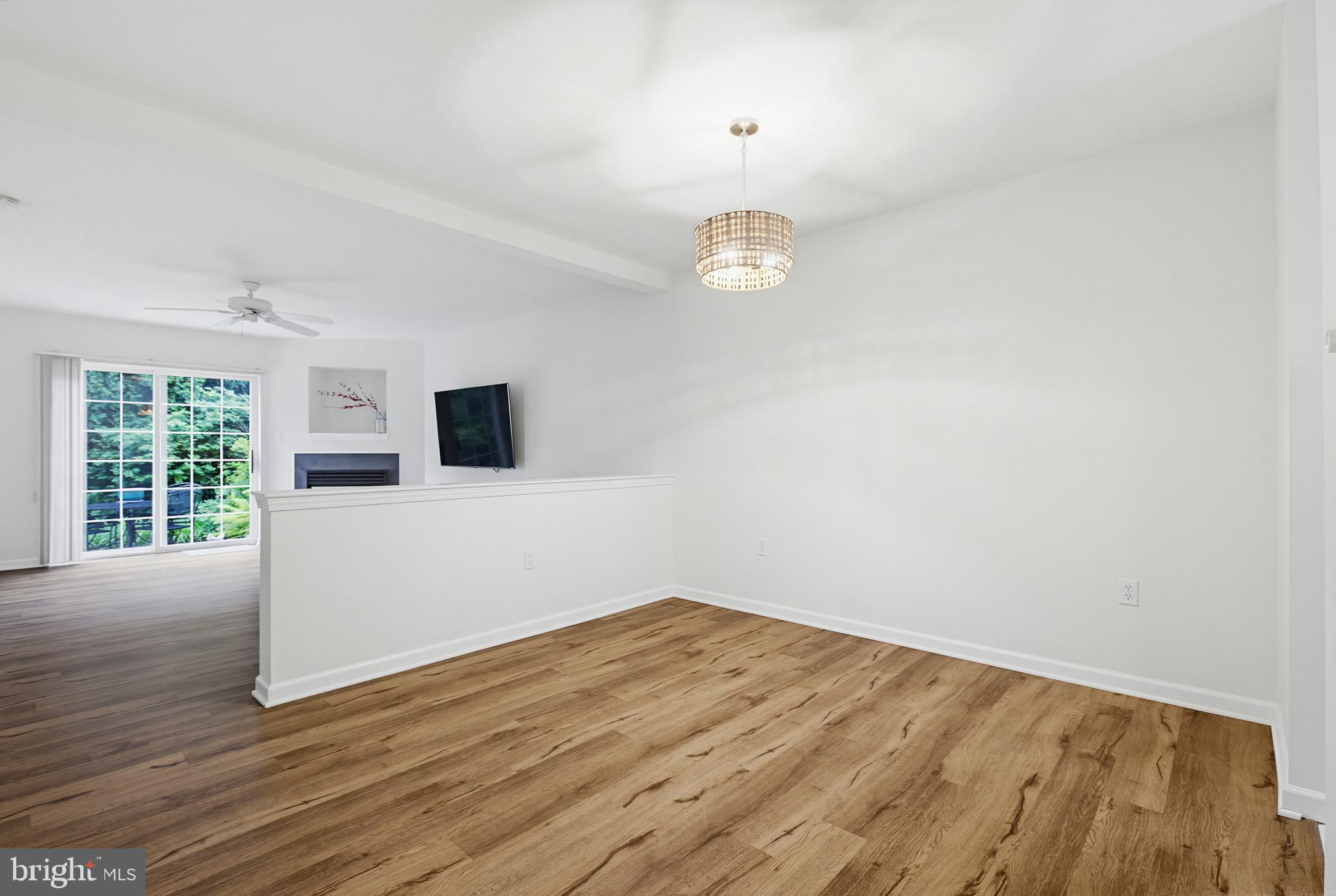 1037 Kent Garden Lititz, PA 17543 - Photo 14 of 31 a view of empty room with wooden floor and window