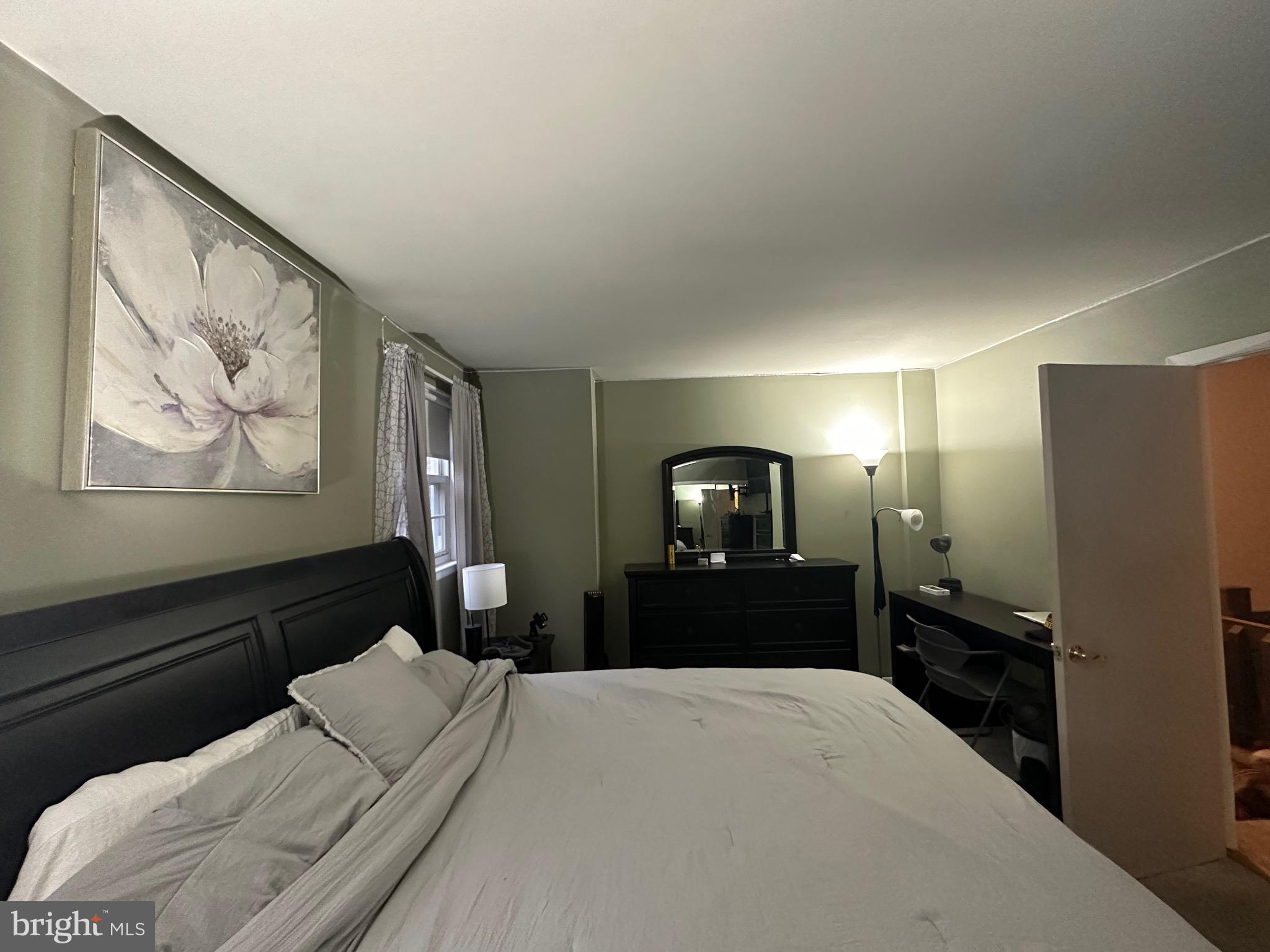 1338 Fox Run Reading, PA 19606 - Photo 15 of 21 a bedroom with a bed and a chandelier