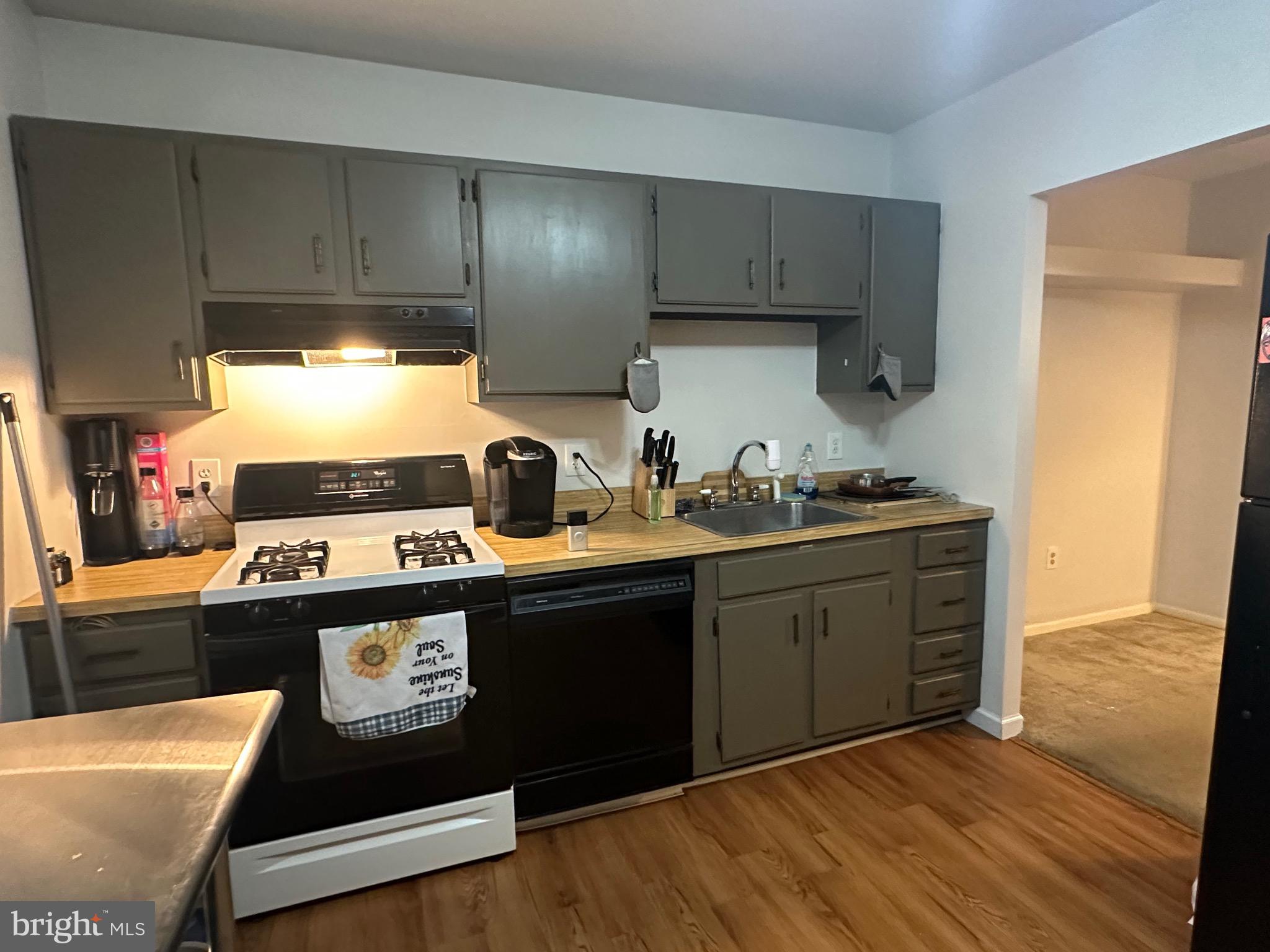 1338 Fox Run Reading, PA 19606 - Photo 5 of 21 a kitchen with wooden cabinets and a stove top oven