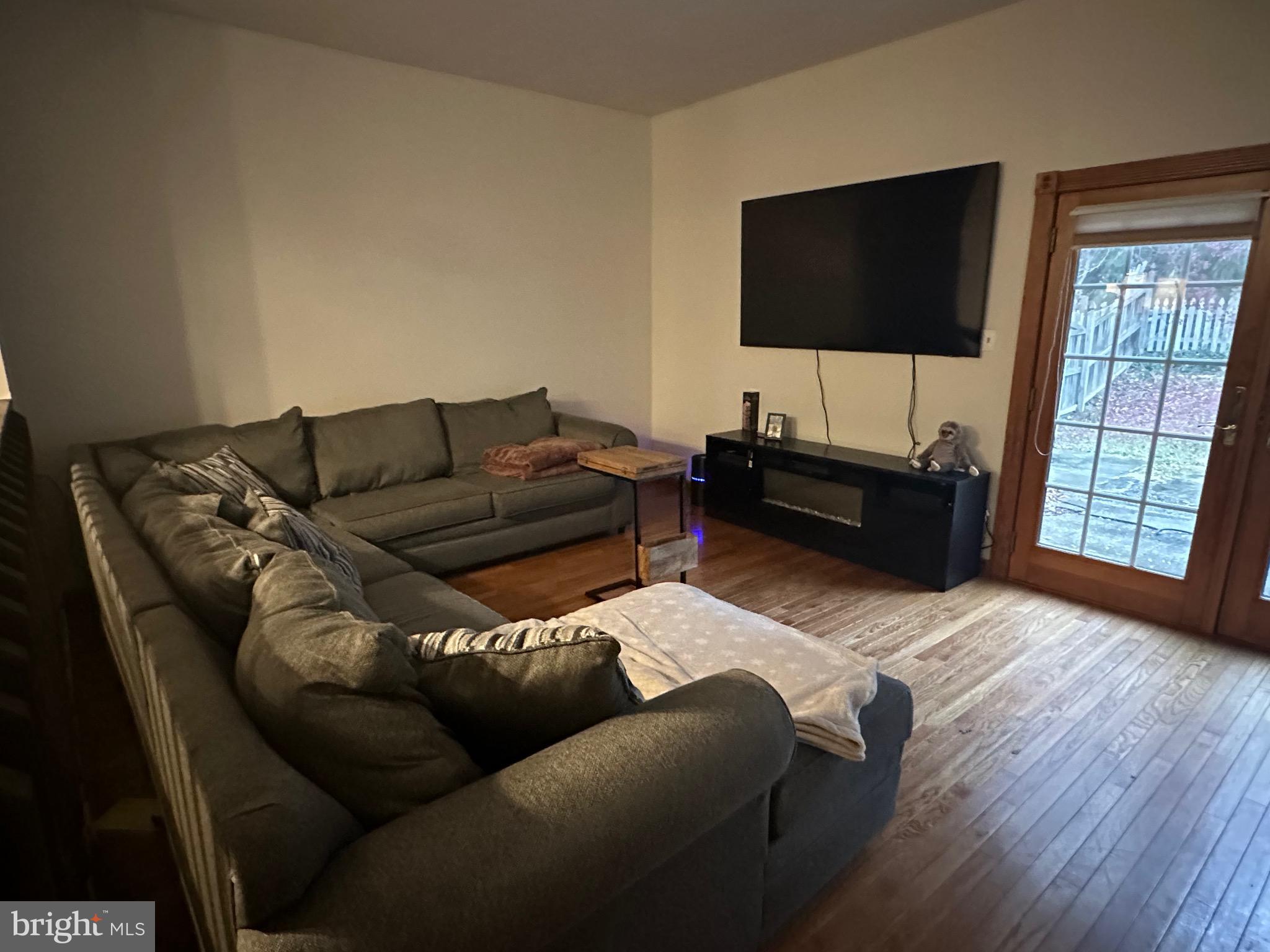 1338 Fox Run Reading, PA 19606 - Photo 8 of 21 a living room with furniture and a flat screen tv