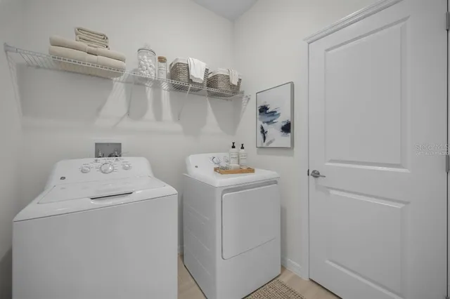 a utility room with dryer and washer
