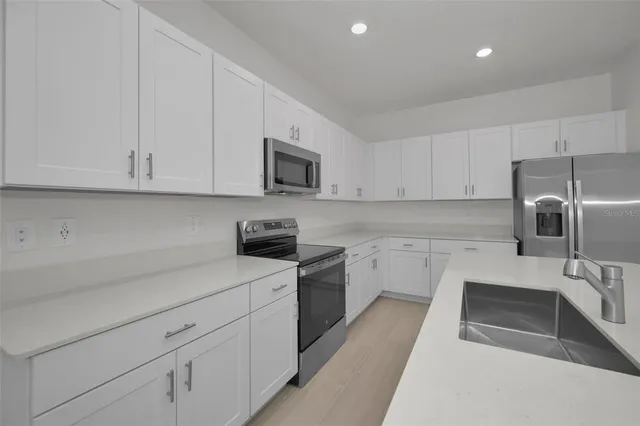 an aerial view of a city with lake view