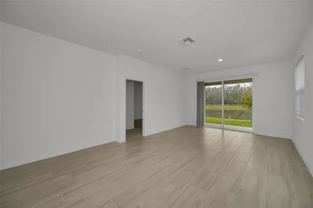 a black and white photo of a open kitchen
