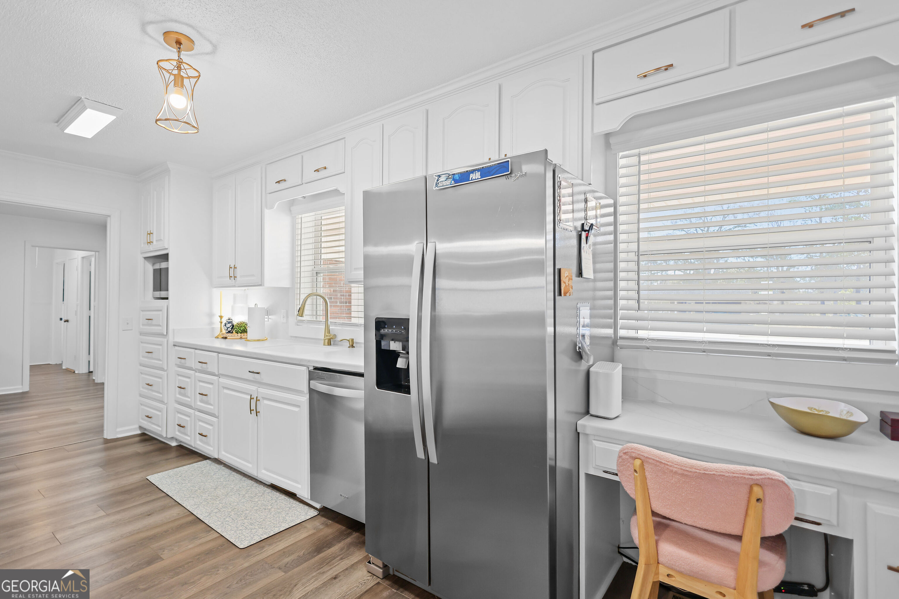 548 South 5th Street Jesup, GA 31545 - Photo 14 of 45 a kitchen with granite countertop a refrigerator and a sink