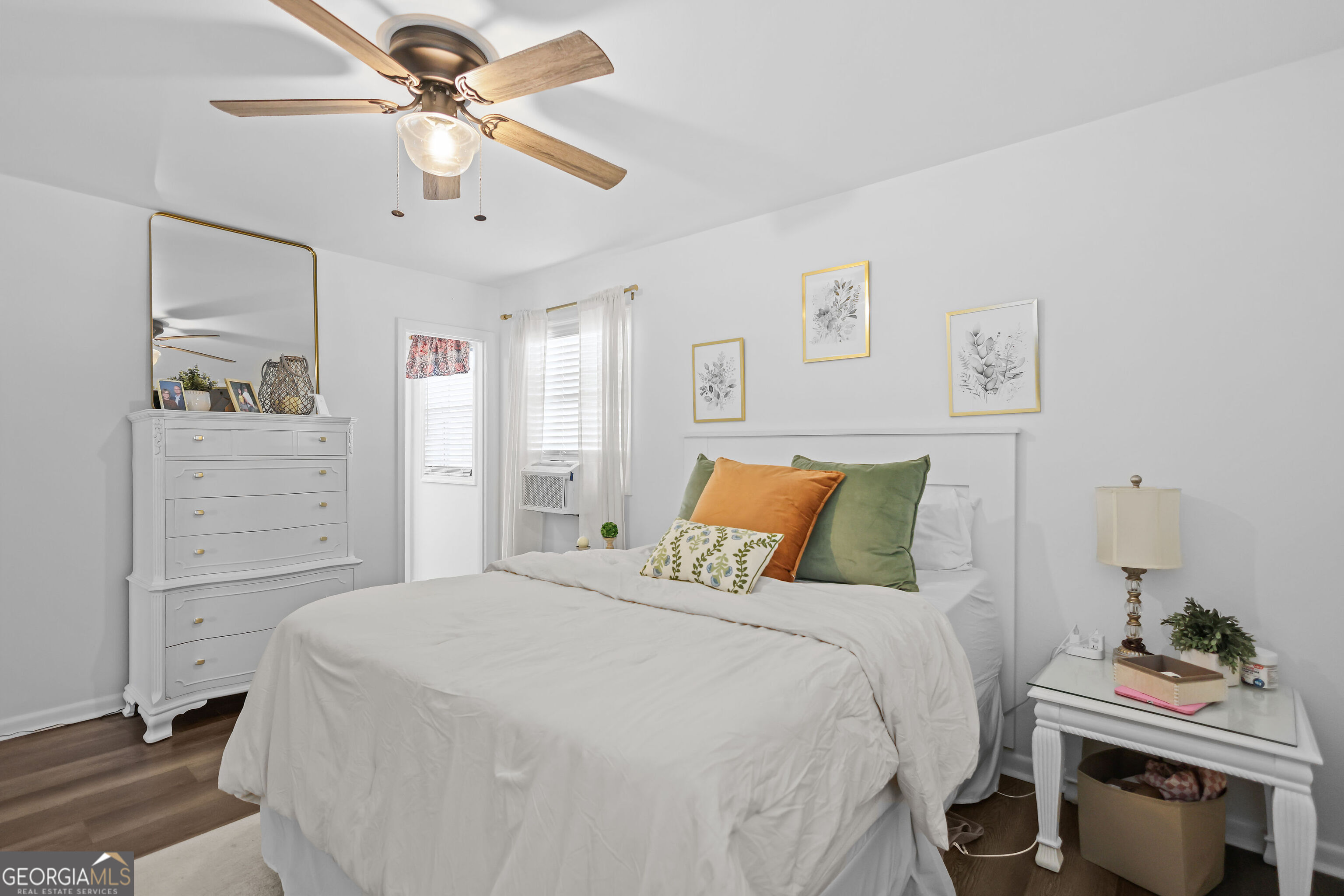 548 South 5th Street Jesup, GA 31545 - Photo 18 of 45 a bedroom with a bed and a chandelier