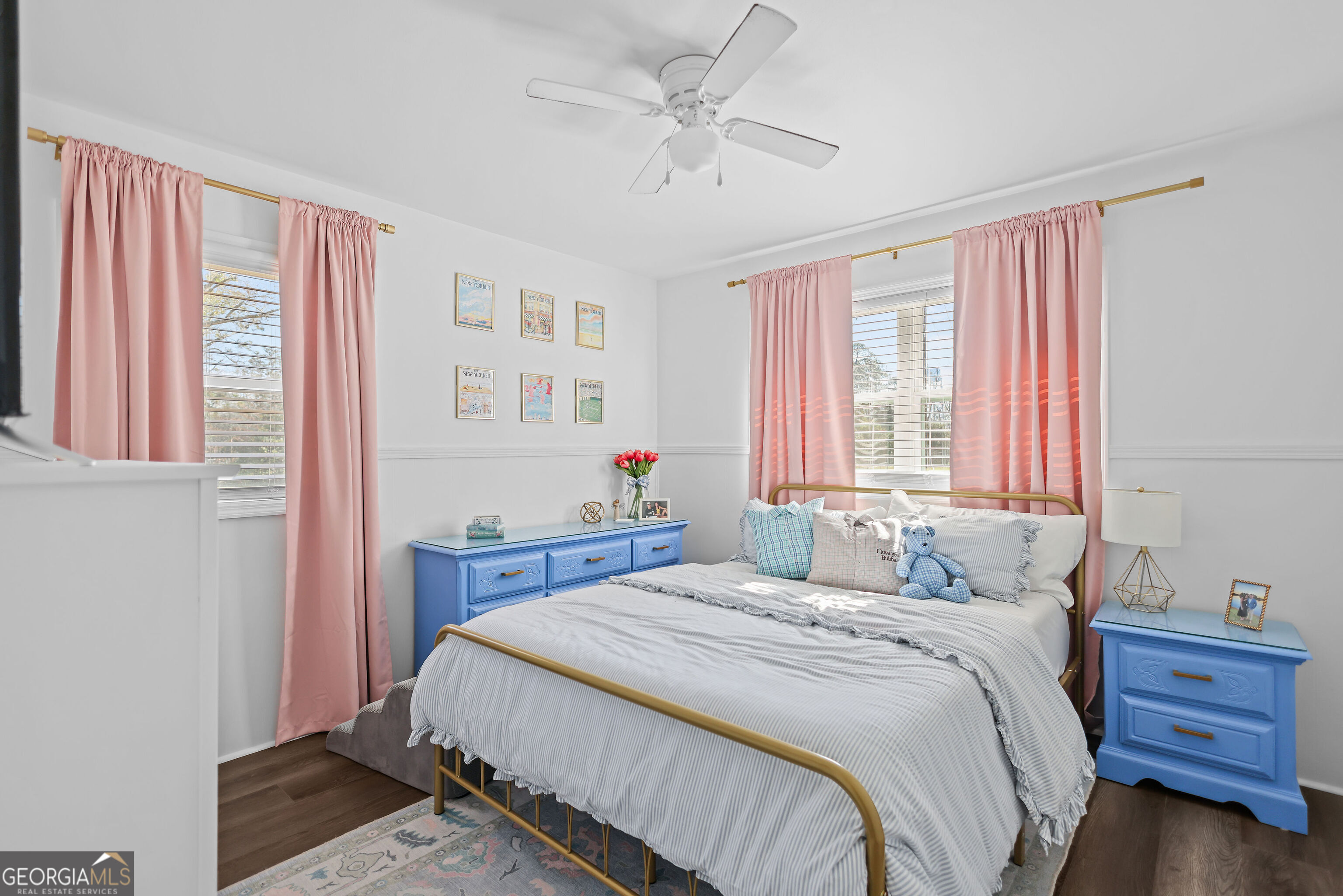 548 South 5th Street Jesup, GA 31545 - Photo 22 of 45 a bedroom with a bed and a chandelier