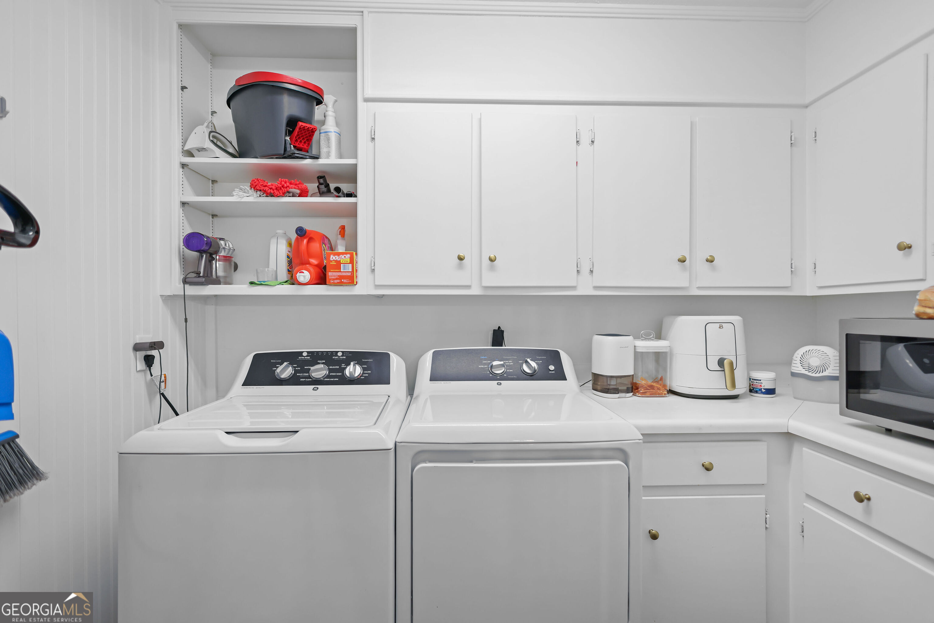 548 South 5th Street Jesup, GA 31545 - Photo 26 of 45 a view of storage and utility room with washer and dryer