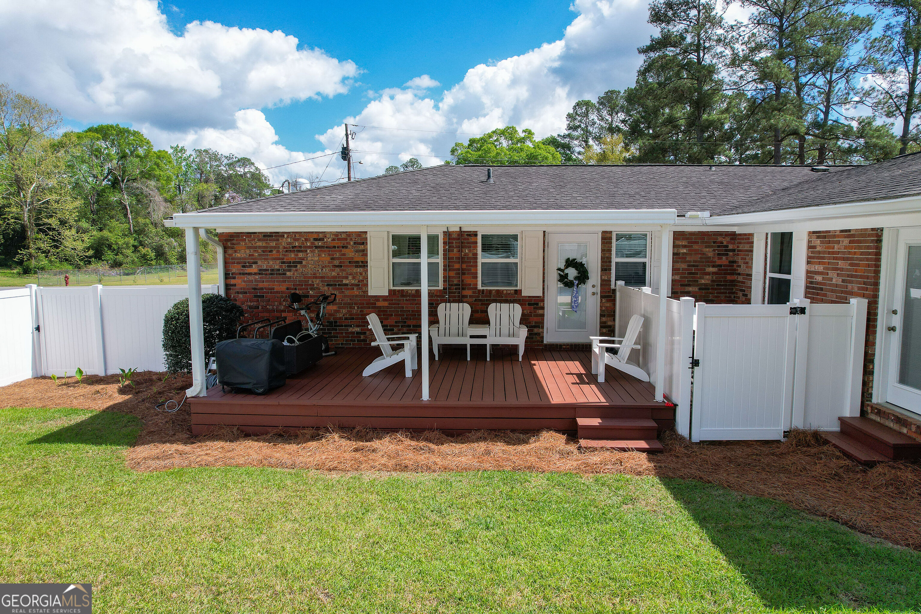 548 South 5th Street Jesup, GA 31545 - Photo 30 of 45 a view of a house with backyard porch and sitting area