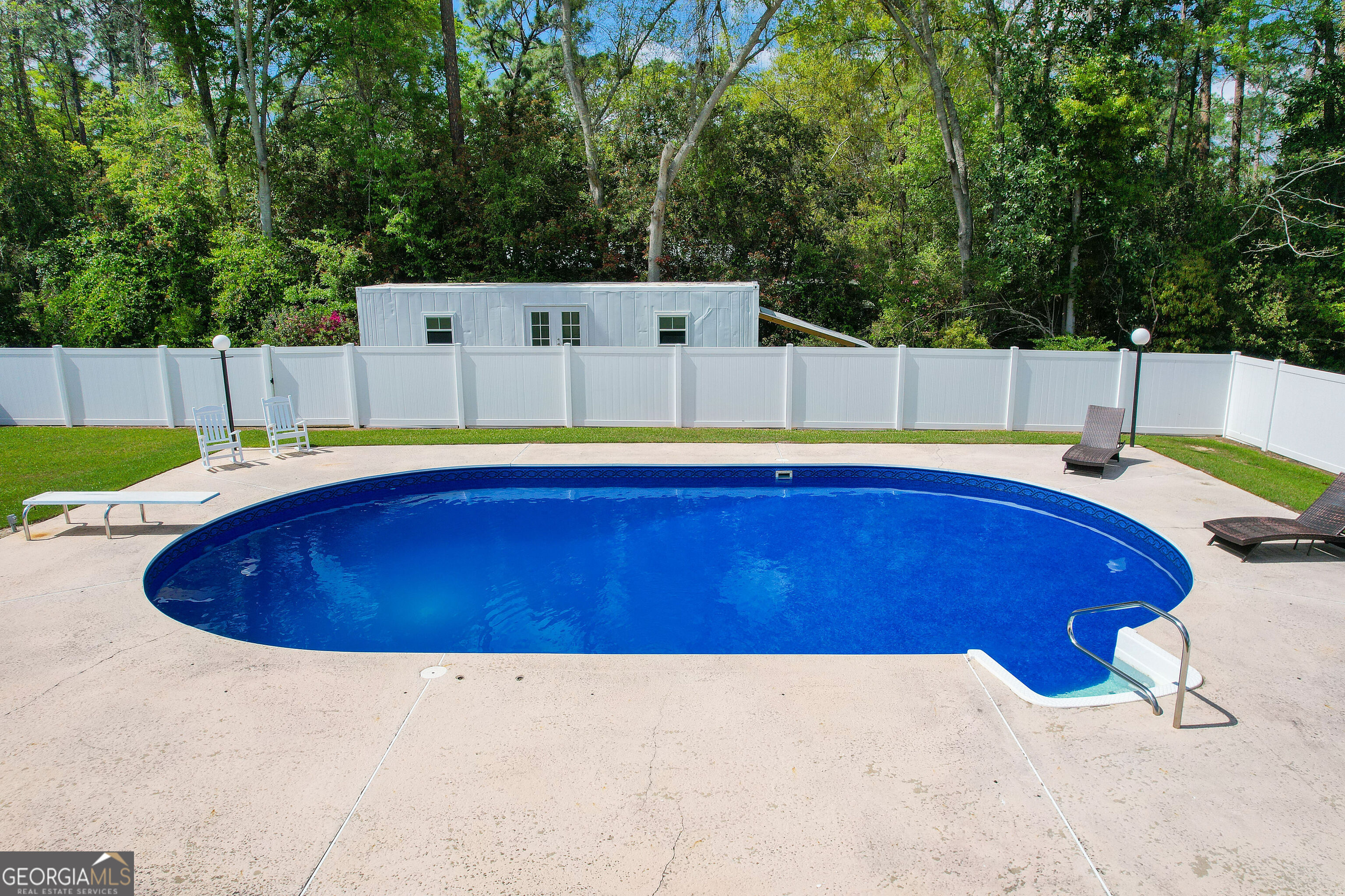 548 South 5th Street Jesup, GA 31545 - Photo 32 of 45 a view of a swimming pool with an outdoor space
