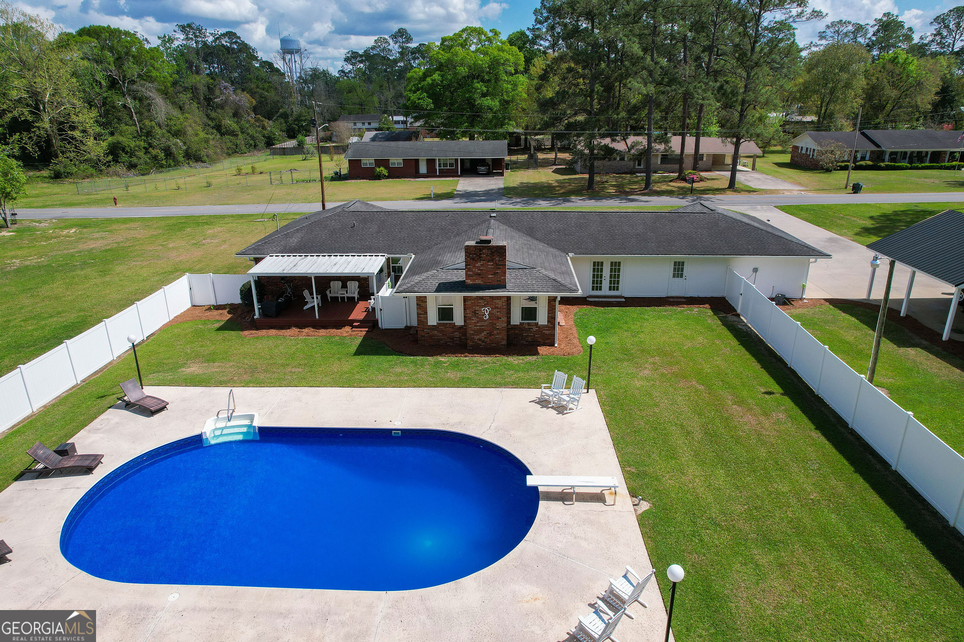548 South 5th Street Jesup, GA 31545 - Photo 37 of 45 a view of a swimming pool with a yard