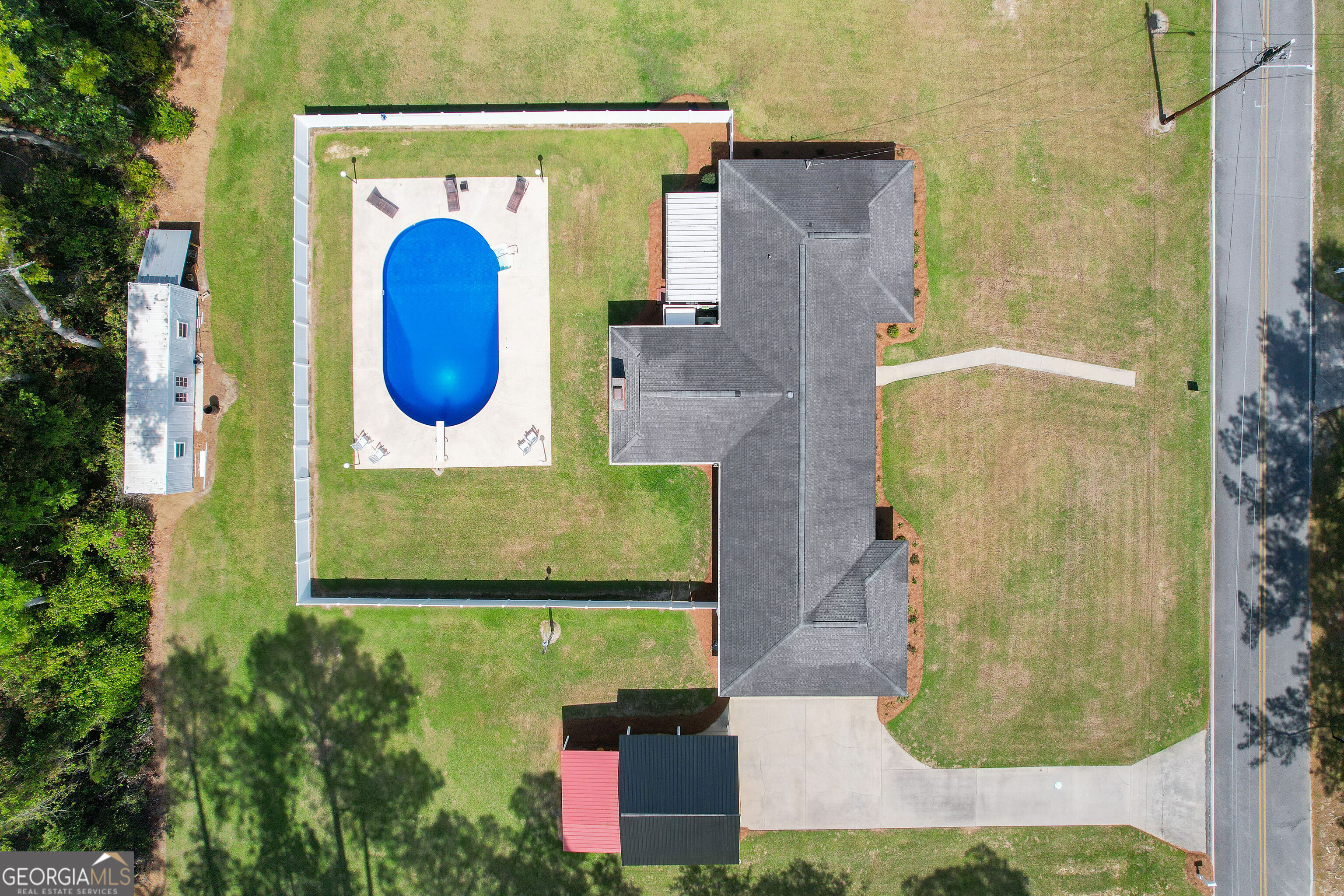 548 South 5th Street Jesup, GA 31545 - Photo 38 of 45 an aerial view of a house with a swimming pool