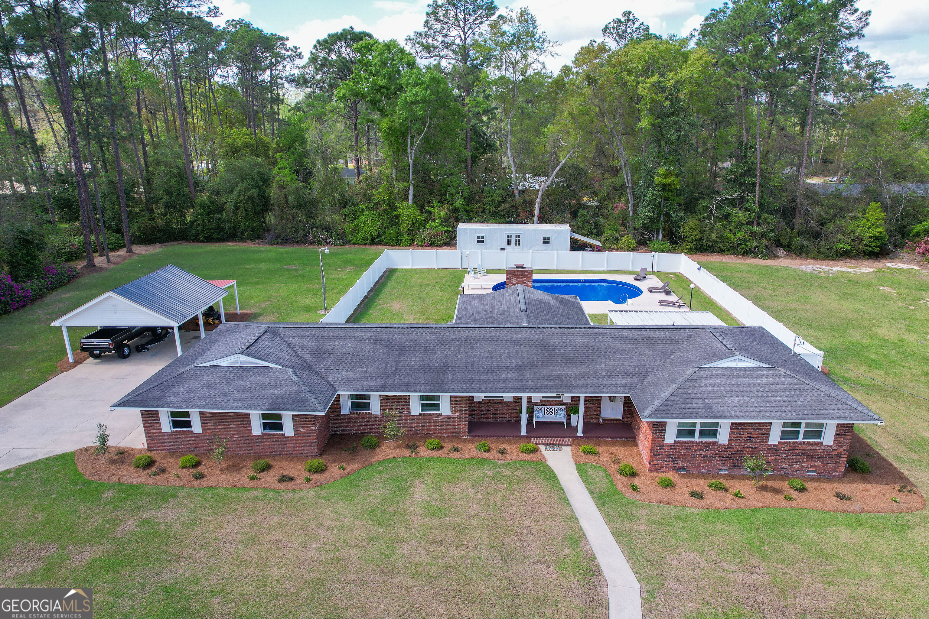 548 South 5th Street Jesup, GA 31545 - Photo 4 of 45 a aerial view of a house with swimming pool and a yard
