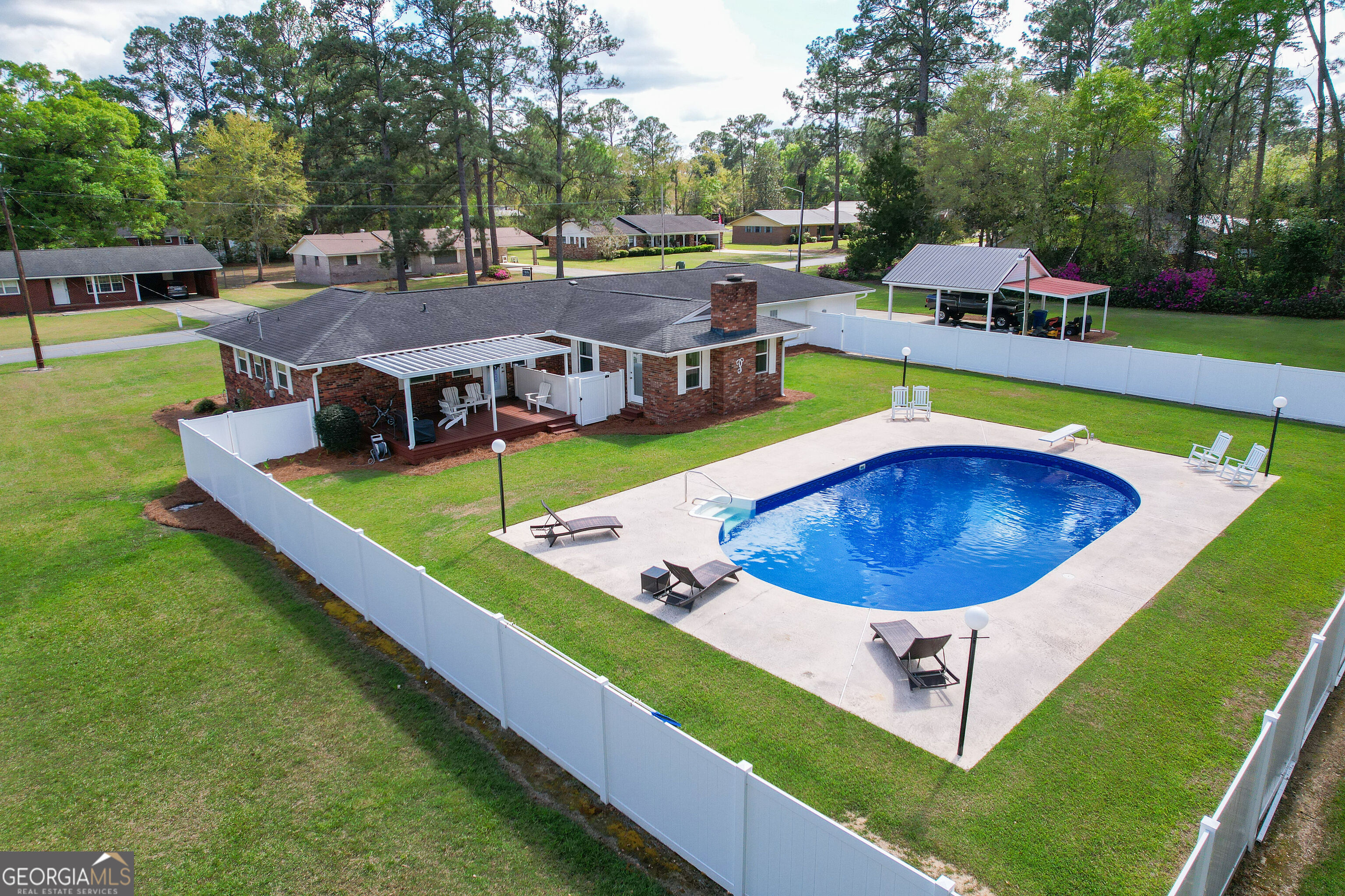 548 South 5th Street Jesup, GA 31545 - Photo 42 of 45 an aerial view of a house with swimming pool and patio