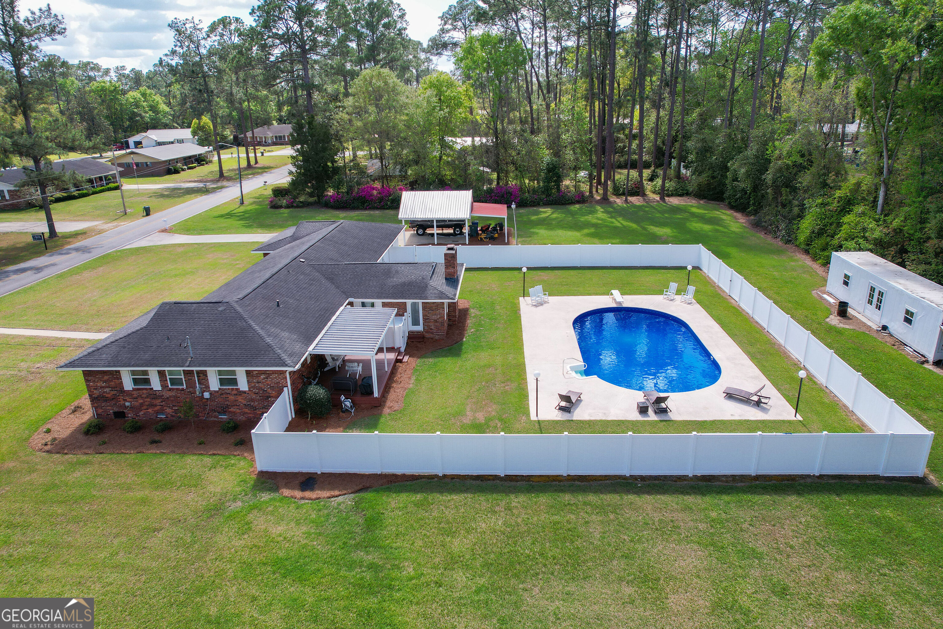 548 South 5th Street Jesup, GA 31545 - Photo 43 of 45 a view of swimming pool with outdoor seating and yard