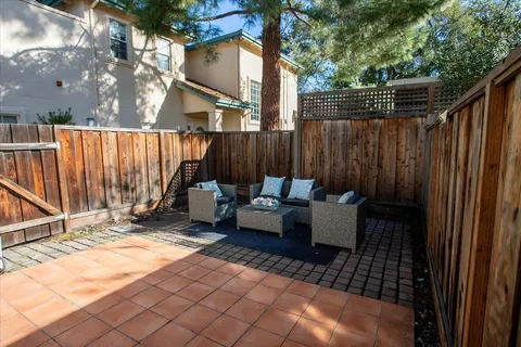 an aerial view of houses with outdoor space