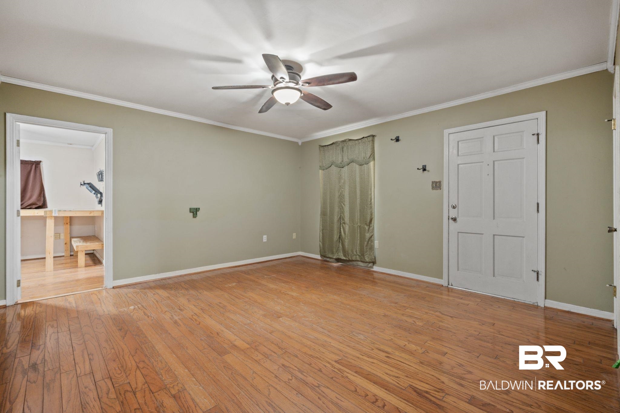 122 Rita Avenue Spanish Fort, AL 36527 - Photo 4 of 17 Spare room with baseboards, ornamental molding, a ceiling fan, and light wood-style floors