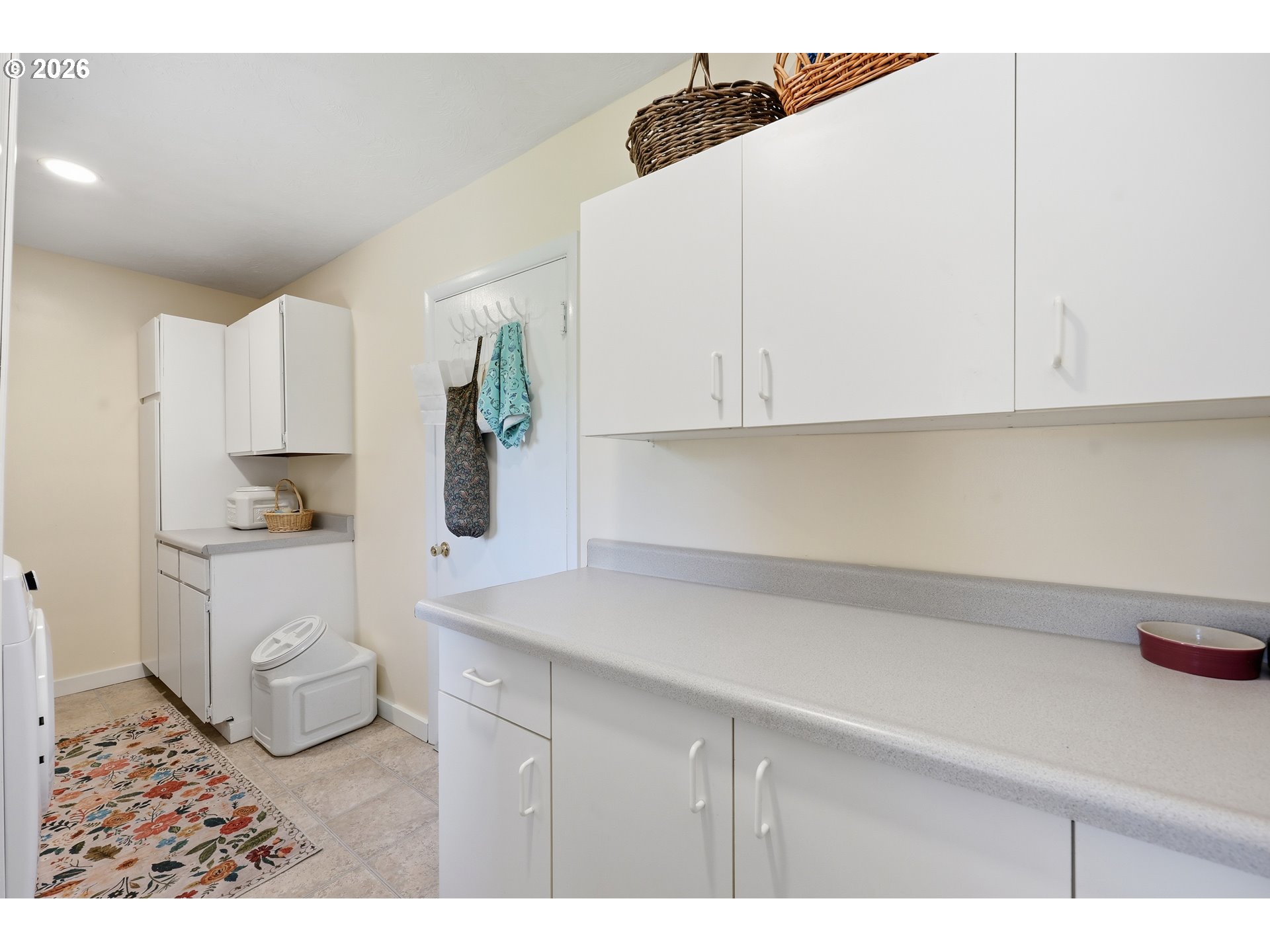 65 Greenvale Drive Springfield, OR 97477 - Photo 19 of 42 a kitchen with white cabinets and white appliances