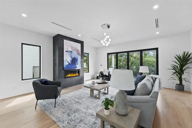 a kitchen with a sink a refrigerator and cabinets