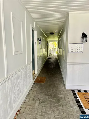 a view of a hallway with windows