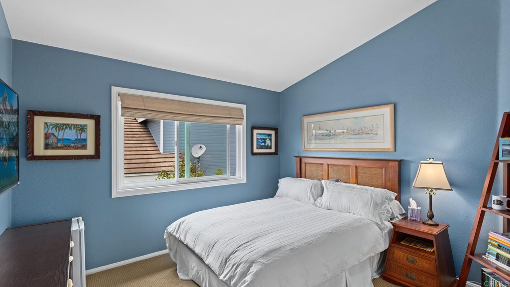 608 Crest Drive Encinitas, CA 92024 - Photo 13 of 25 a bedroom with a bed and a window with chair