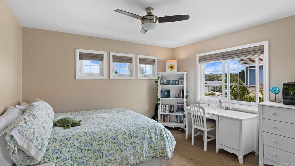 608 Crest Drive Encinitas, CA 92024 - Photo 15 of 25 a bedroom with a bed furniture and a window