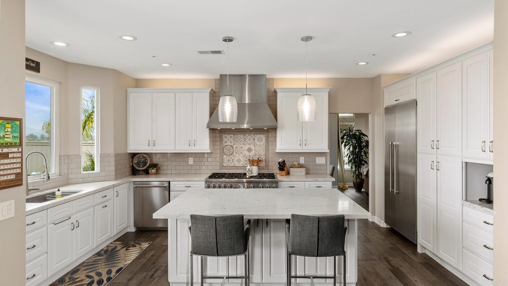 608 Crest Drive Encinitas, CA 92024 - Photo 18 of 25 a kitchen with a sink stove and refrigerator