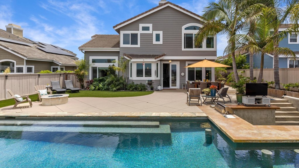 608 Crest Drive Encinitas, CA 92024 - Photo 20 of 25 a front view of a house with swimming pool and sitting area