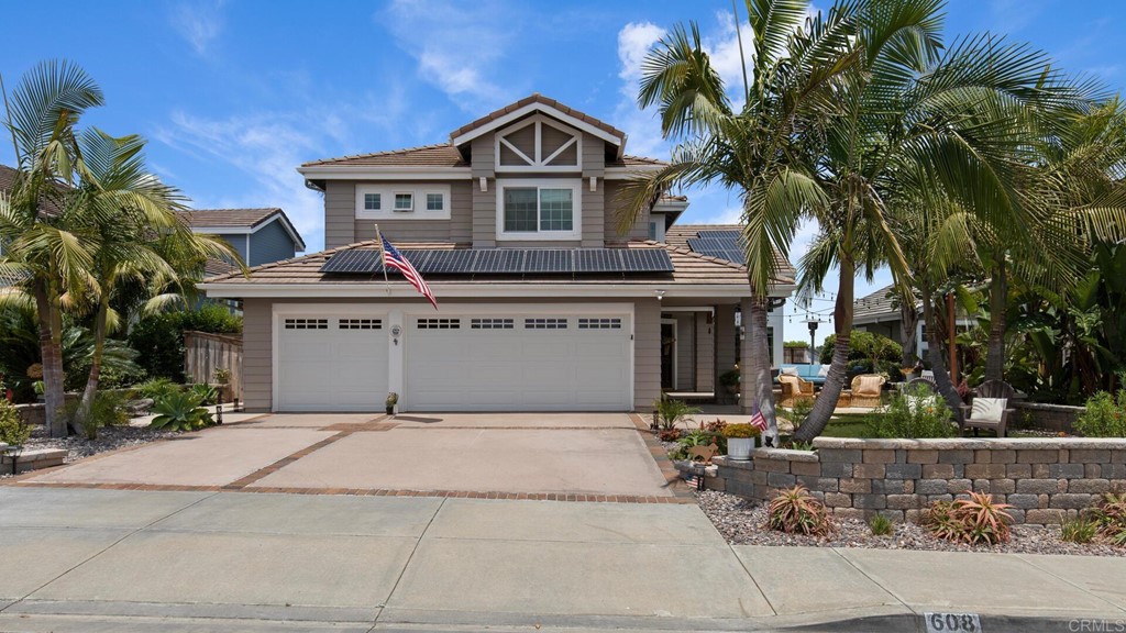 608 Crest Drive Encinitas, CA 92024 - Photo 2 of 25 a front view of a house with a garden