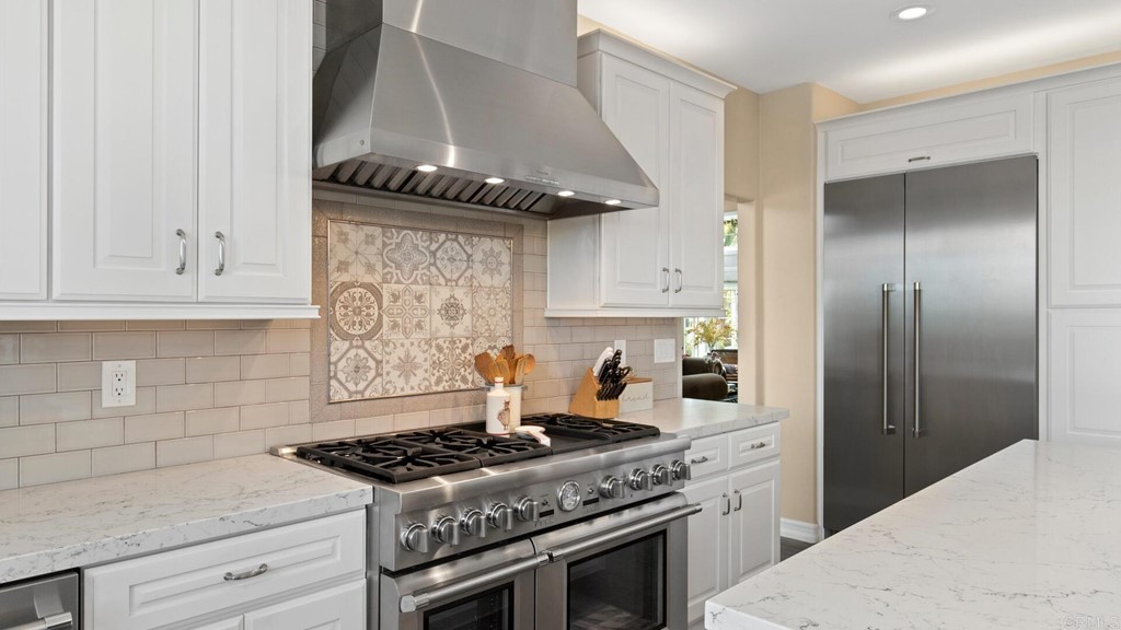 608 Crest Drive Encinitas, CA 92024 - Photo 5 of 25 a stove top oven sitting inside of a kitchen