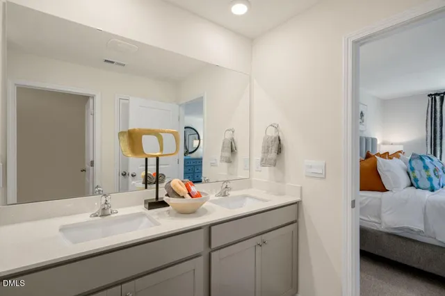 a bathroom with a granite countertop sink toilet tub and shower