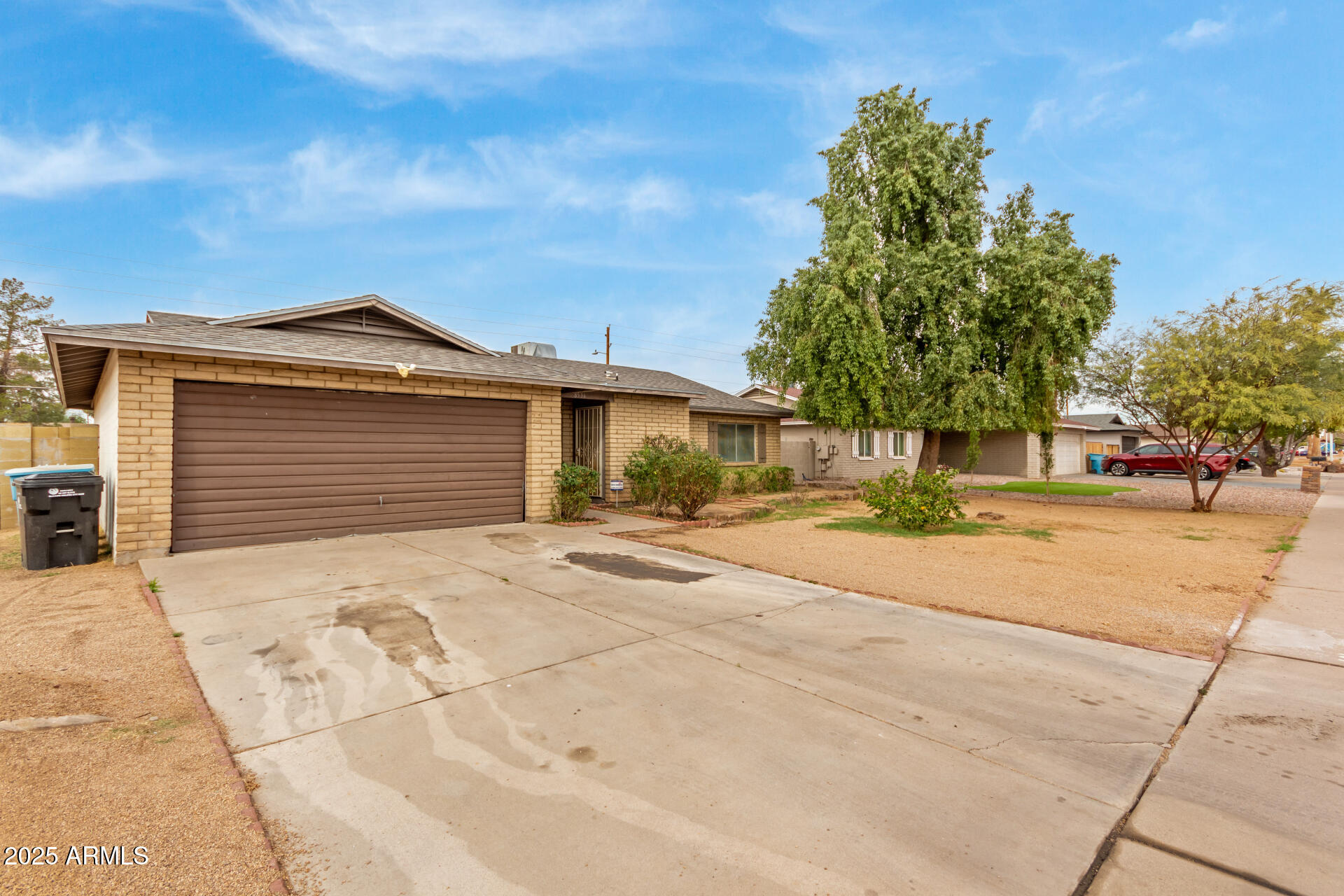 8536 North 42nd Drive Phoenix, AZ 85051 - Photo 12 of 39 a front view of a house with a yard and garage