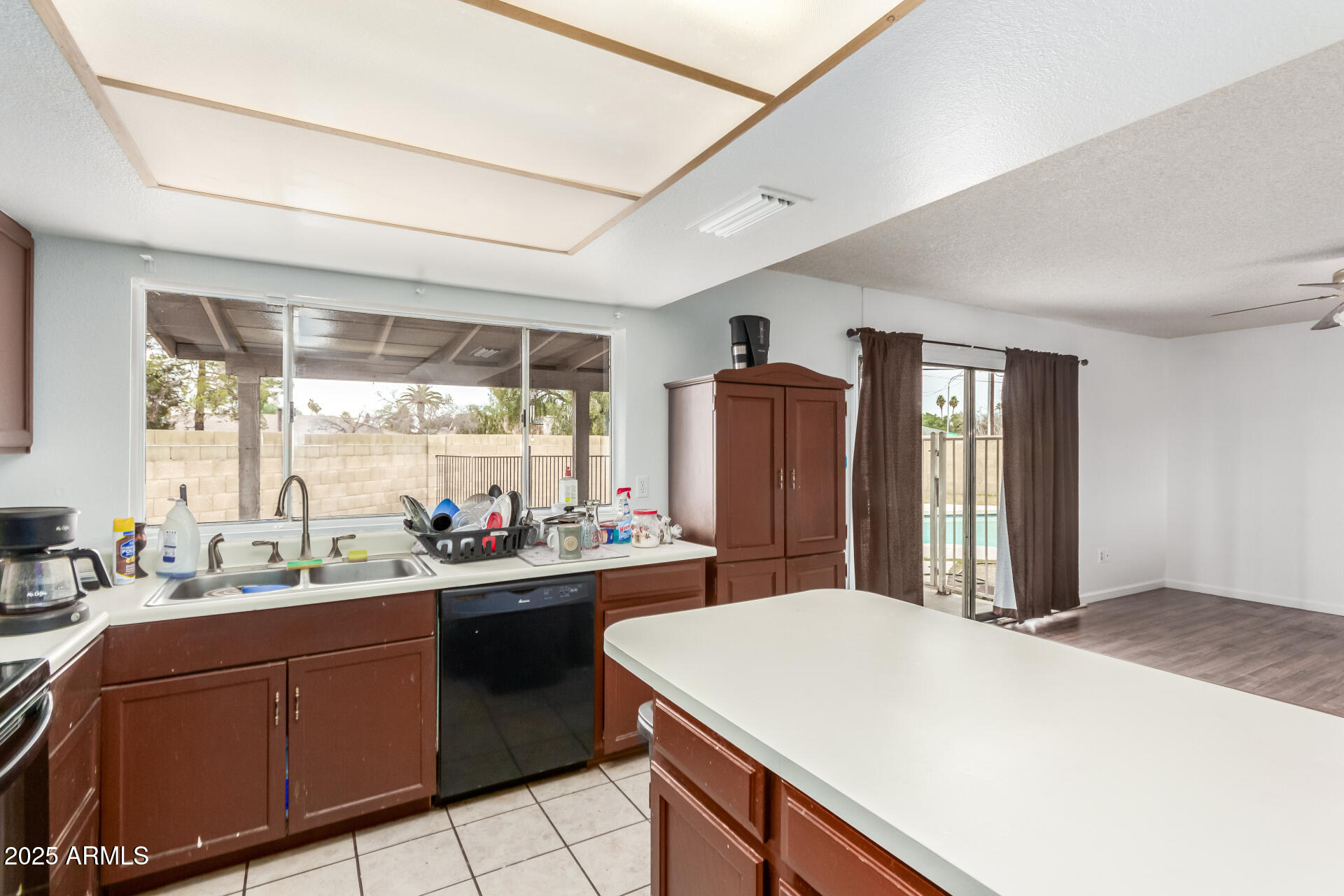 8536 North 42nd Drive Phoenix, AZ 85051 - Photo 19 of 39 a kitchen with a sink stove and refrigerator