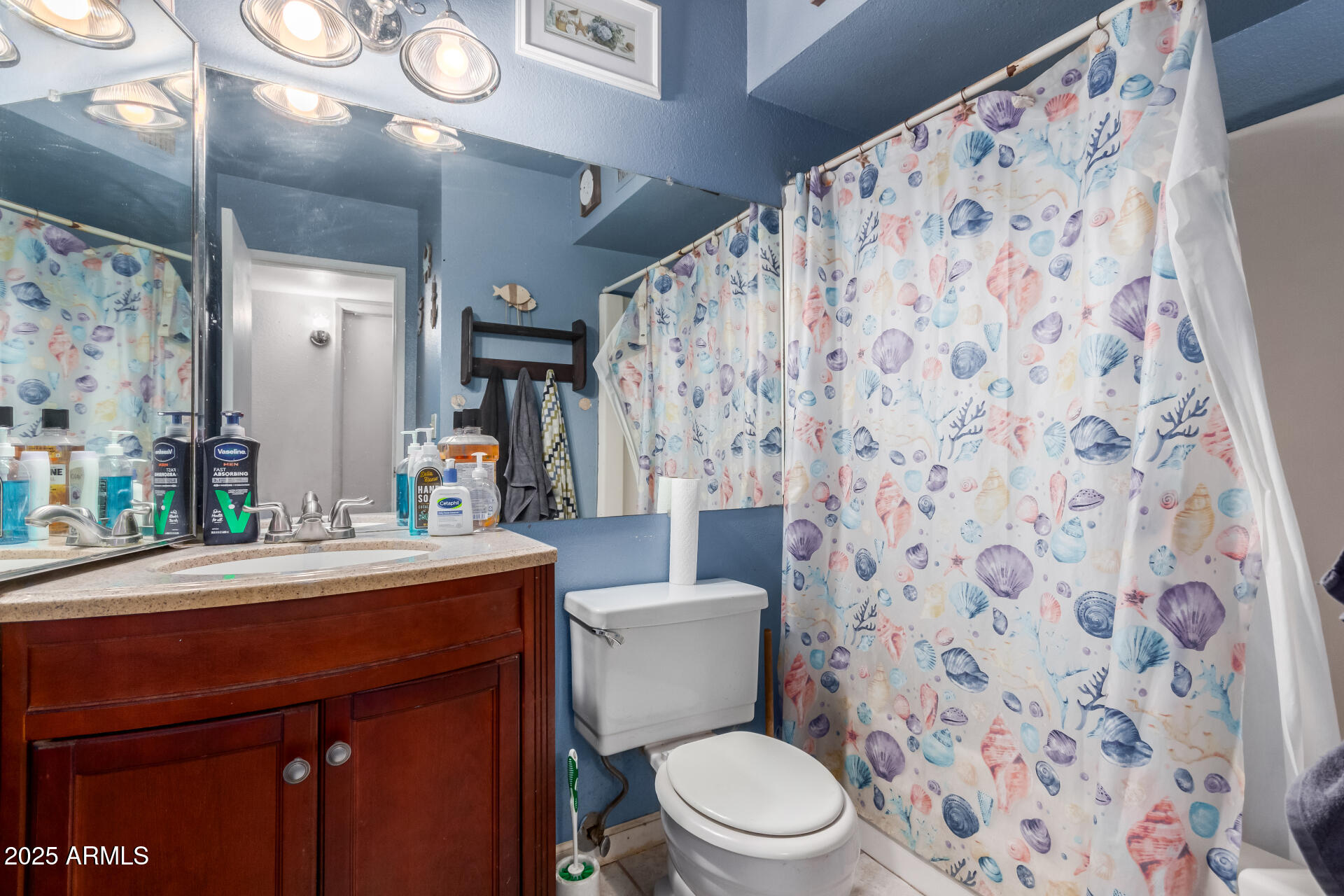 8536 North 42nd Drive Phoenix, AZ 85051 - Photo 26 of 39 a bathroom with a toilet and a sink