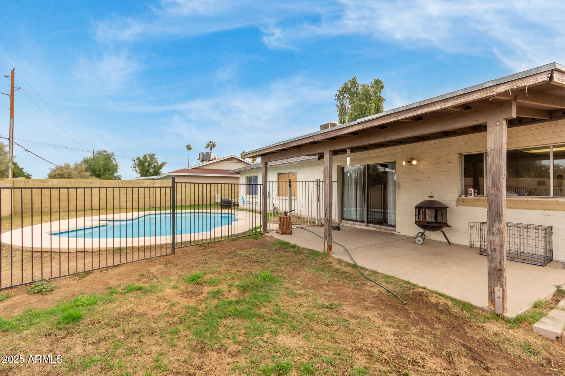 8536 North 42nd Drive Phoenix, AZ 85051 - Photo 27 of 39 a view of a house with backyard and porch