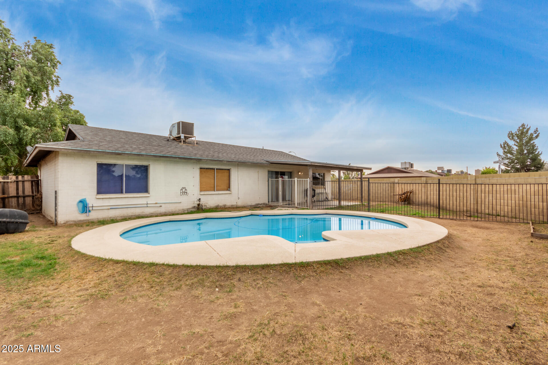 8536 North 42nd Drive Phoenix, AZ 85051 - Photo 29 of 39 a front view of a house with a yard