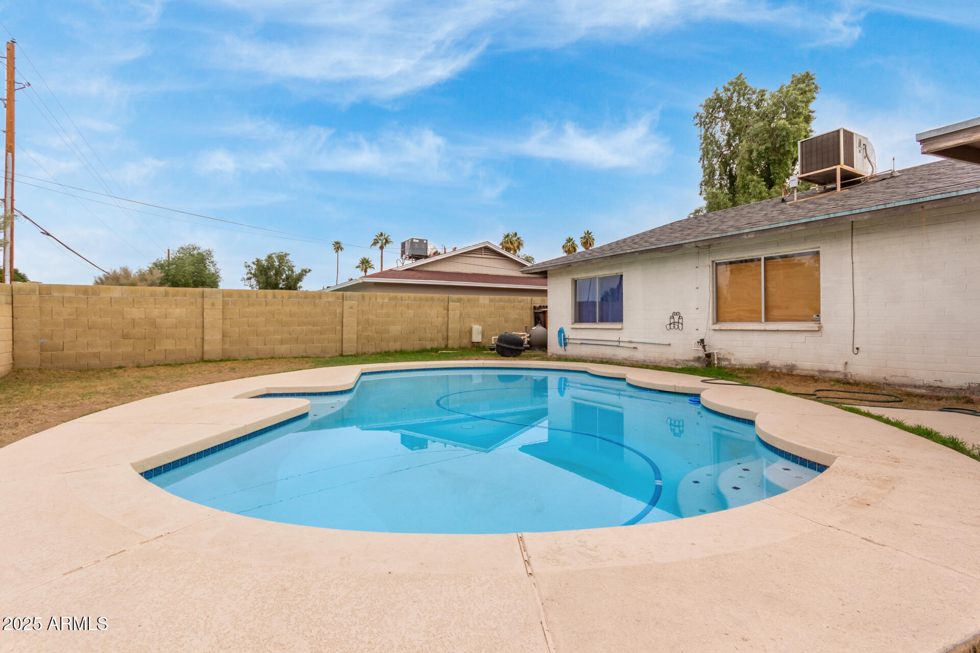 8536 North 42nd Drive Phoenix, AZ 85051 - Photo 31 of 39 a view of a swimming pool with a lounge chairs