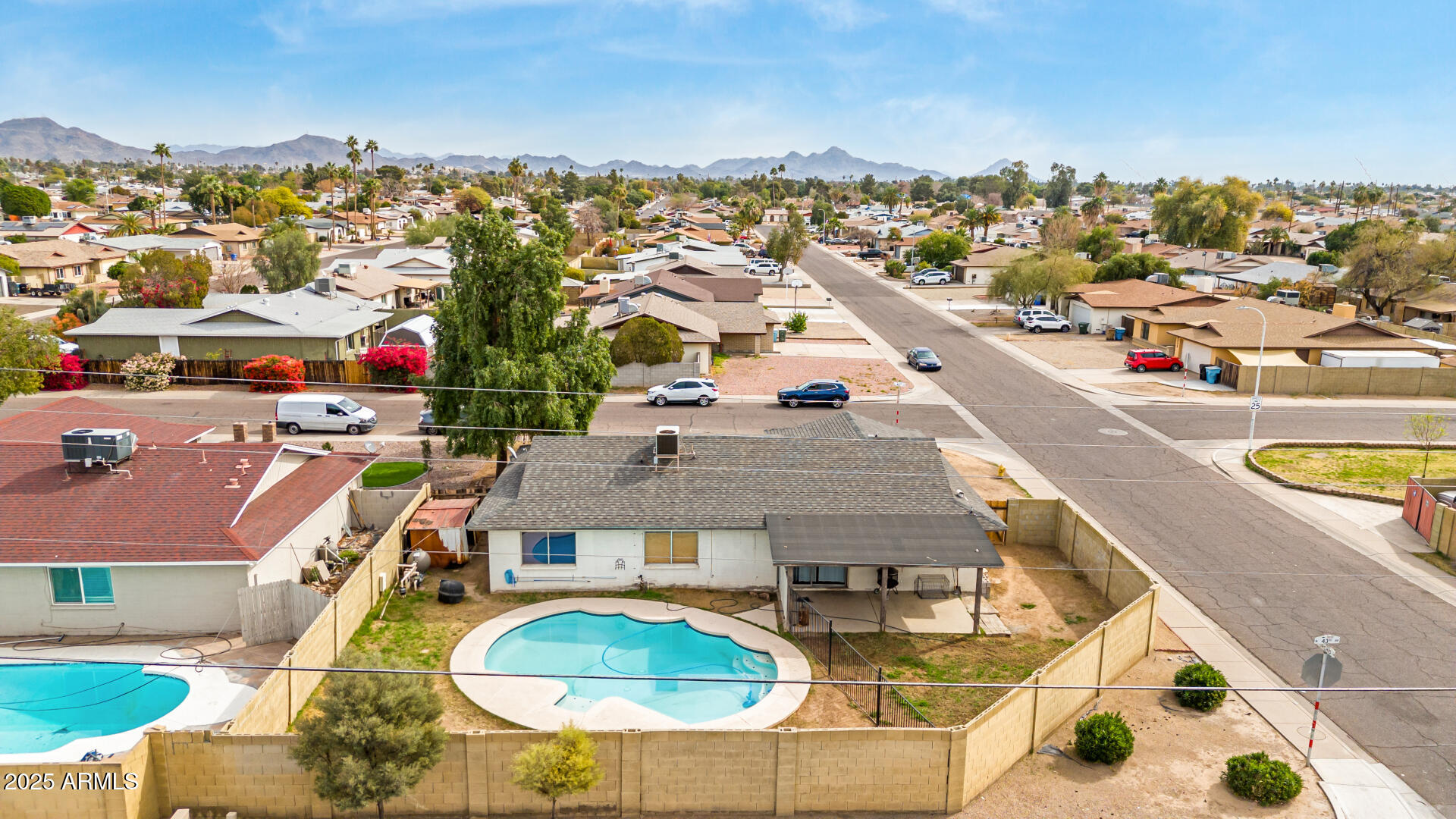 8536 North 42nd Drive Phoenix, AZ 85051 - Photo 37 of 39 an aerial view of residential houses with outdoor space