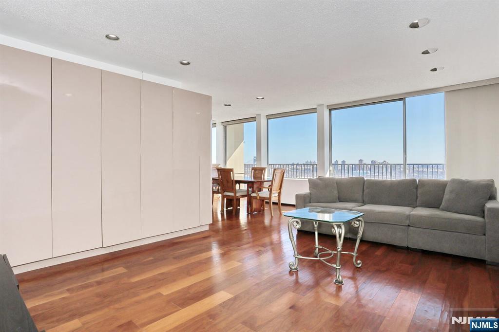 3 Horizon Road, Unit 1432 Fort Lee, NJ 07024 - Photo 14 of 49 a living room with furniture and wooden floor
