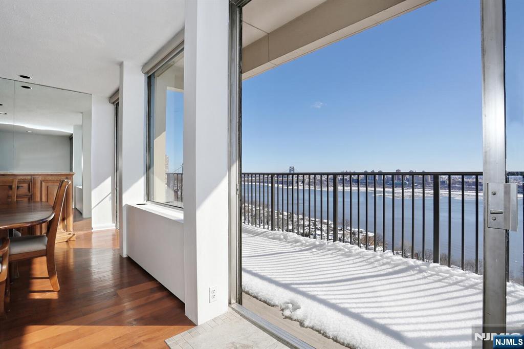 3 Horizon Road, Unit 1432 Fort Lee, NJ 07024 - Photo 17 of 49 a view of a balcony and wooden floor