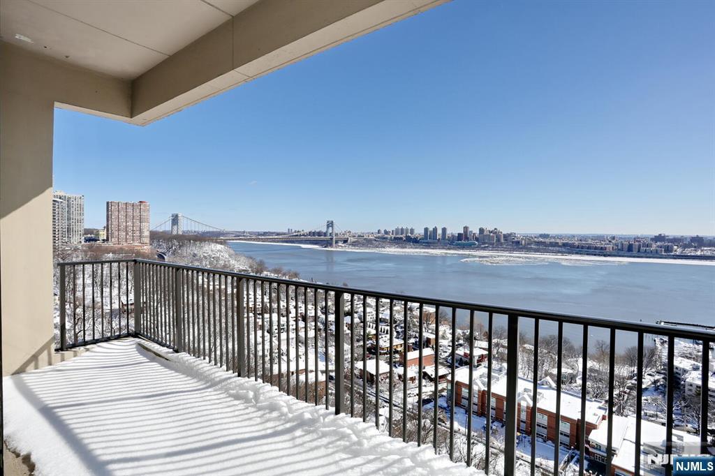 3 Horizon Road, Unit 1432 Fort Lee, NJ 07024 - Photo 19 of 49 a view of a balcony with wooden floor and fence