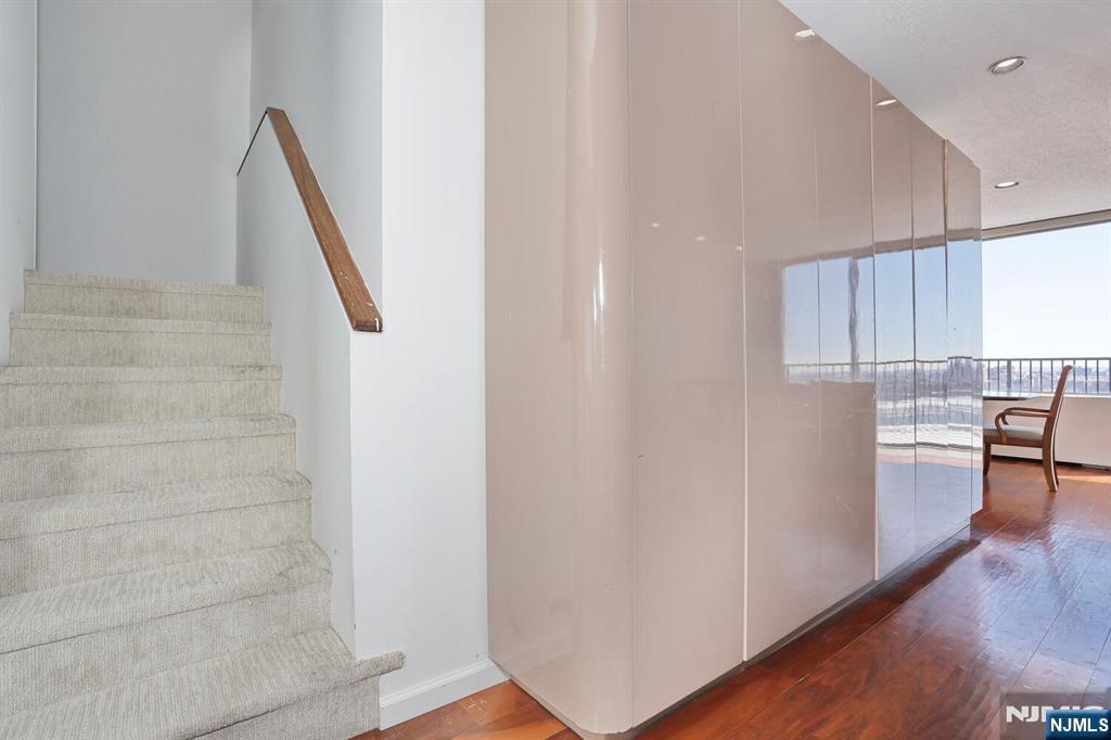 3 Horizon Road, Unit 1432 Fort Lee, NJ 07024 - Photo 30 of 49 a view of kitchen with cabinets and wooden floor