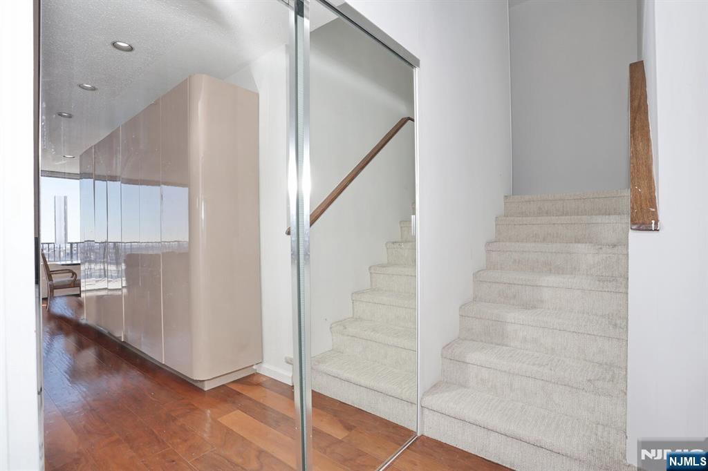 3 Horizon Road, Unit 1432 Fort Lee, NJ 07024 - Photo 31 of 49 a view of entryway and hall with wooden floor