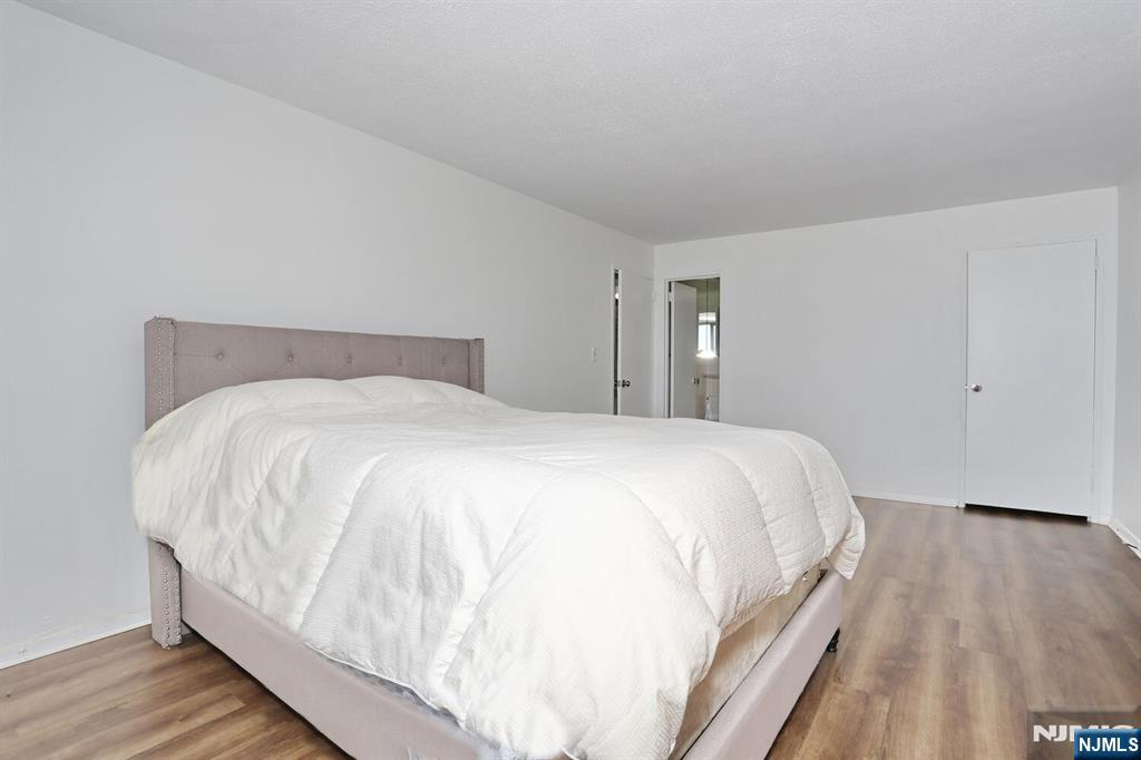 3 Horizon Road, Unit 1432 Fort Lee, NJ 07024 - Photo 33 of 49 a large white bed in a white room