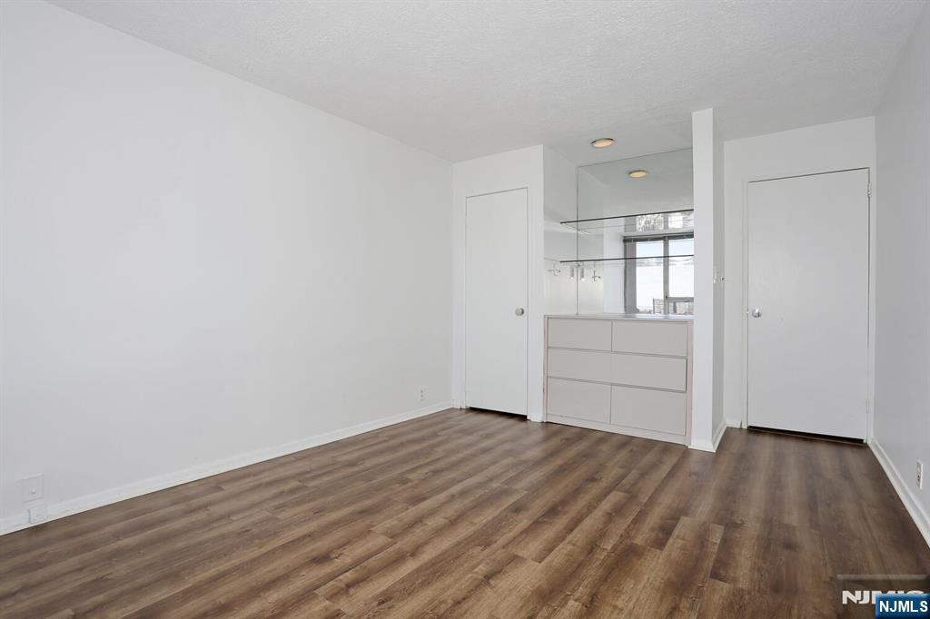 3 Horizon Road, Unit 1432 Fort Lee, NJ 07024 - Photo 39 of 49 wooden floor in an empty room