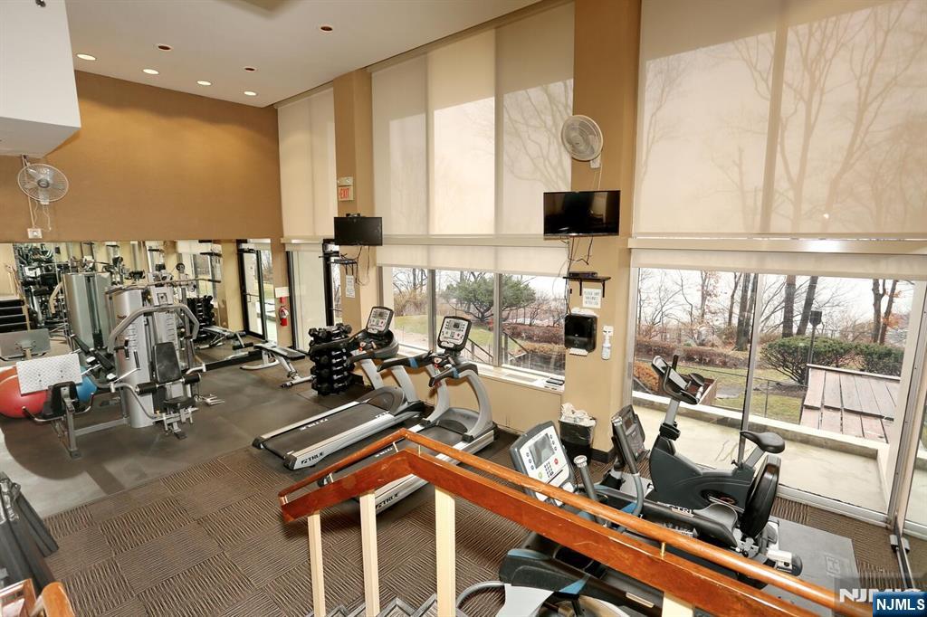3 Horizon Road, Unit 1432 Fort Lee, NJ 07024 - Photo 42 of 49 a room with gym equipment and large window