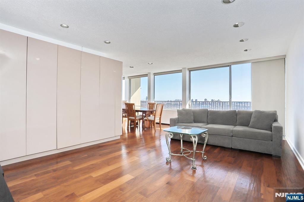 3 Horizon Road, Unit 1432 Fort Lee, NJ 07024 - Photo 8 of 49 a living room with furniture and wooden floor